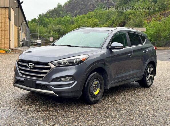 KM8J3CA2XGU194869 2016 HYUNDAI TUCSON Gray Trasero izquierdo