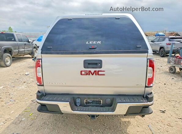1GTP6DE16J1243605 2018 GMC CANYON Серебряный Вид салона спереди
