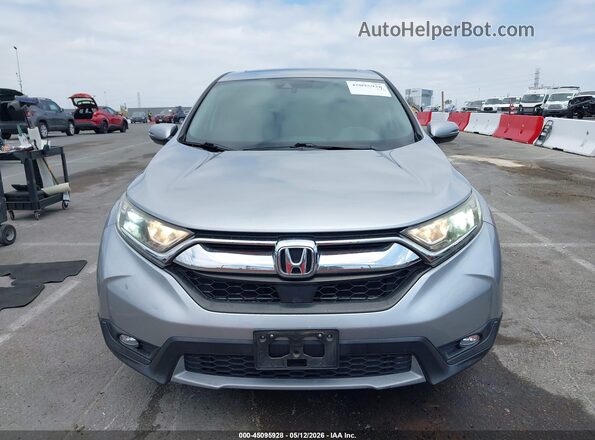 7FARW1H84HE035695 2017 HONDA CR-V Серебряный Вид задней части салона