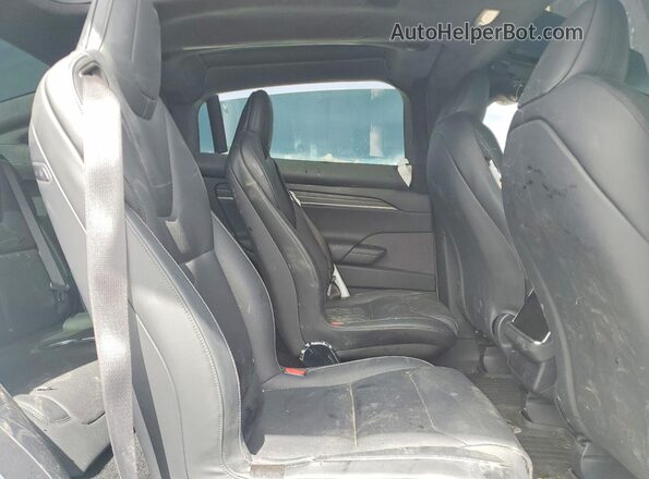 7SAXCBE62RF453942 2024 TESLA MODEL White Вид задньої частини салону
