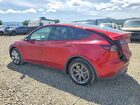 2024 Tesla Model Y Red vin: 7SAYGAEE6RF069513