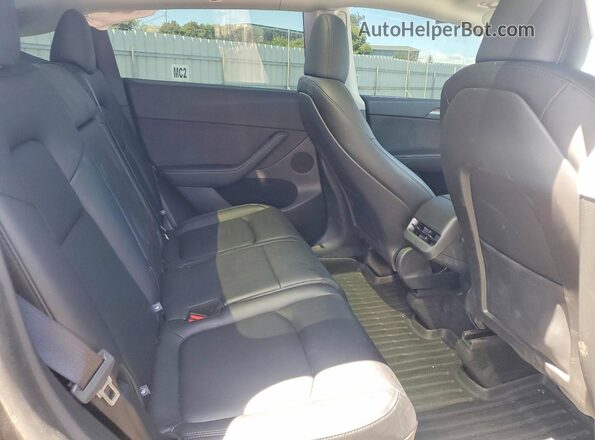 7SAYGAEE8SF282064 2025 TESLA MODEL Charcoal Vista de los asientos traseros