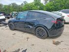 2025 Tesla Model Y Black vin: 7SAYGAEE8SF293114