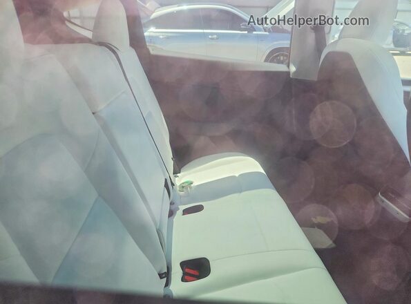 7SAYGDED0SF228833 2025 TESLA MODEL White Rear seats view