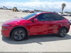 2026 Tesla Model Y Red vin: 7SAYGDED0TF426491