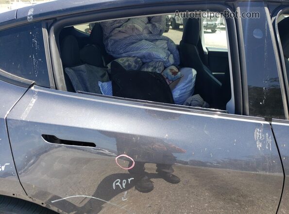 7SAYGDED2PF946424 2023 TESLA MODEL Gray Vista de los asientos traseros