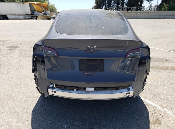 7SAYGDED2PF946424 2023 TESLA MODEL Gray Vista trasera