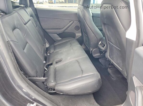 7SAYGDED2SF314063 2025 TESLA MODEL Black Rear interior view