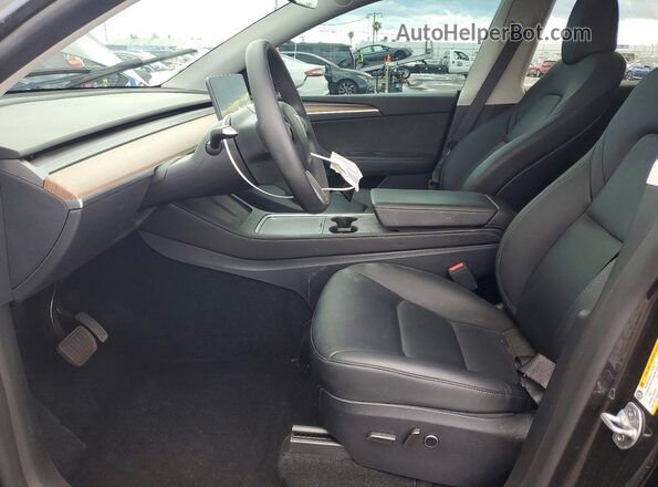 7SAYGDED2SF314063 2025 TESLA MODEL Black Front interior view