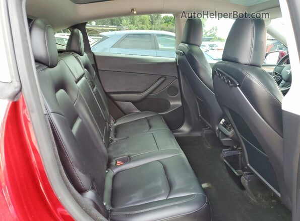 7SAYGDED3RF006121 2024 TESLA MODEL Red Rear interior view