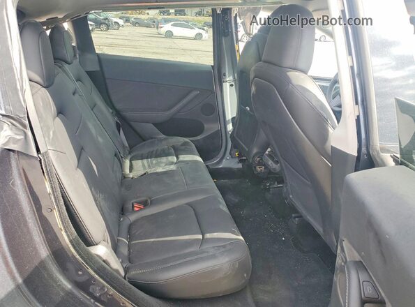 7SAYGDED4RF154410 2024 TESLA MODEL Gray Вид задніх сидінь