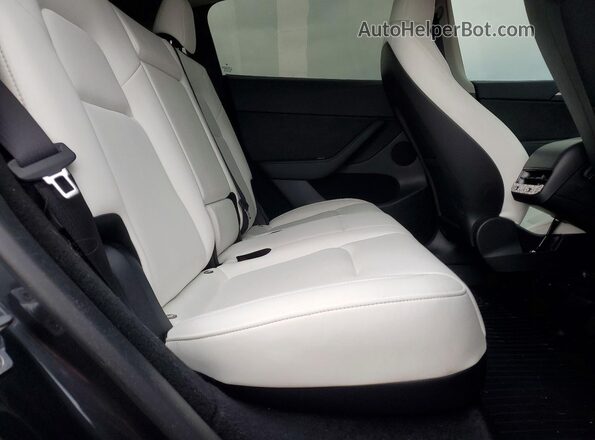 7SAYGDED5RF009814 2024 TESLA MODEL Pink Rear seats view