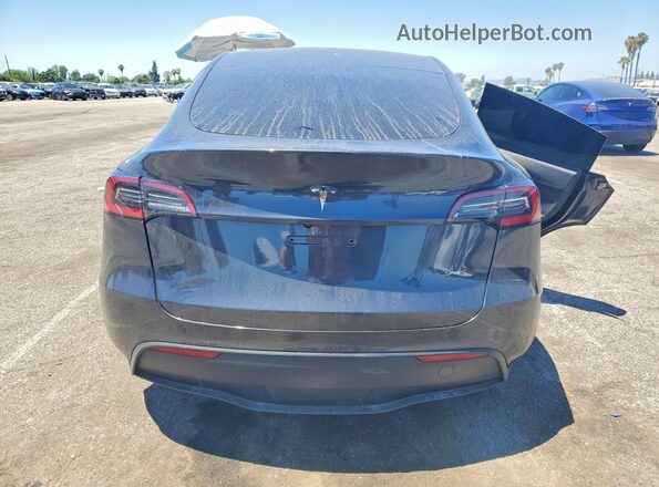 7SAYGDED5RF057684 2024 TESLA MODEL Gray Rear view