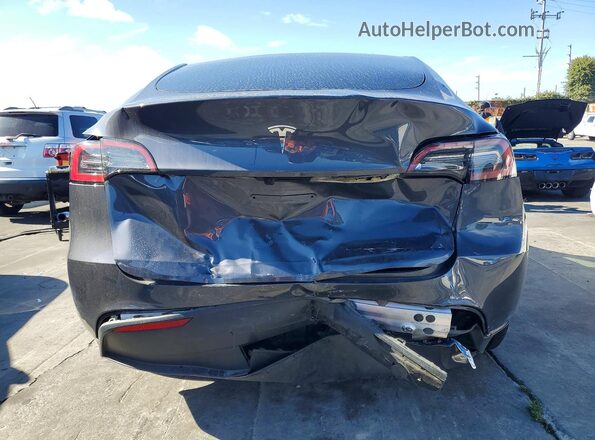 7SAYGDED6PF956339 2023 TESLA MODEL Gray Rear view