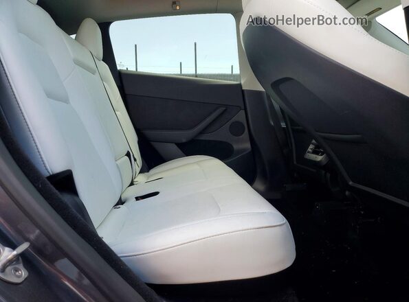7SAYGDED6PF956339 2023 TESLA MODEL Gray Rear seats view