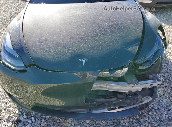 7SAYGDED6SF231266 2025 TESLA MODEL Gray Vista interior trasera