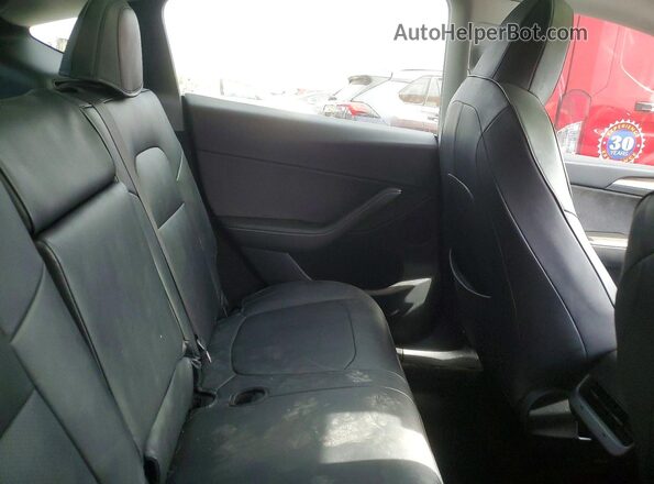 7SAYGDED7PF942577 2023 TESLA MODEL Gray Vista de los asientos traseros
