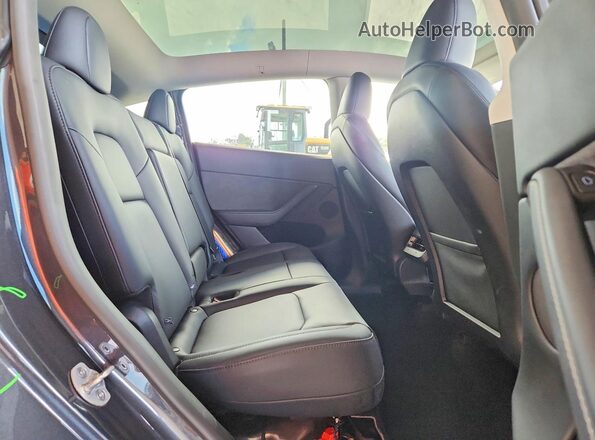 7SAYGDED7RA310758 2024 TESLA MODEL Charcoal Vista interior trasera
