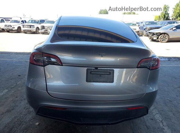 7SAYGDED7SF318691 2025 TESLA MODEL Gray Vista trasera