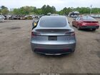 2024 Tesla Model Y Long Range Dual Motor All-wheel Drive Gray vin: 7SAYGDEE1RA316497