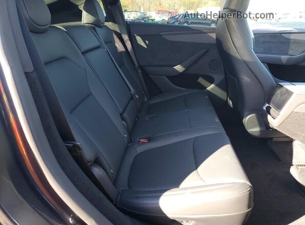 7SAYGDEE1TA410578 2026 TESLA MODEL Charcoal Vista de los asientos traseros