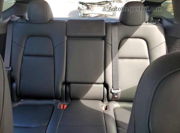 7SAYGDEE2RF130356 2024 TESLA MODEL Charcoal Vista de los asientos traseros
