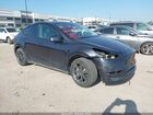 2024 Tesla Model Y Long Range Dual Motor All-wheel Drive Gray vin: 7SAYGDEE3RA301127