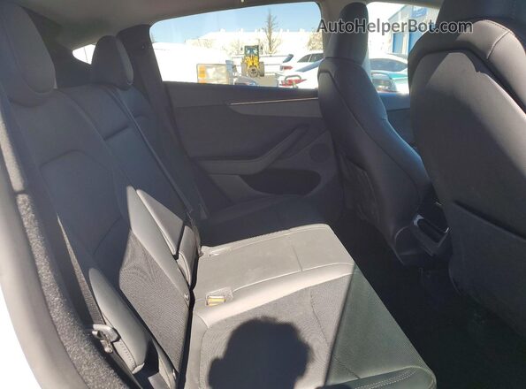 7SAYGDEE3TF364903 2026 TESLA MODEL White Vista interior trasera