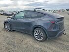 2026 Tesla Model Y Black vin: 7SAYGDEE4TF356101