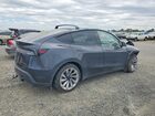 2026 Tesla Model Y Black vin: 7SAYGDEE4TF356101