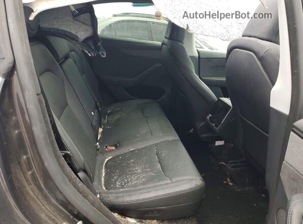 7SAYGDEE4TF356101 2026 TESLA MODEL Black Vista de los asientos traseros