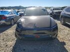 2026 Tesla Model Y Black vin: 7SAYGDEE4TF564513