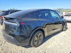 2026 Tesla Model Y Black vin: 7SAYGDEE4TF564513