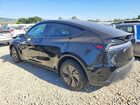 2026 Tesla Model Y Black vin: 7SAYGDEE4TF564513
