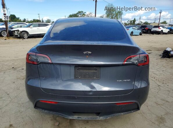 7SAYGDEE5PF945924 2023 TESLA MODEL Gray Vista trasera