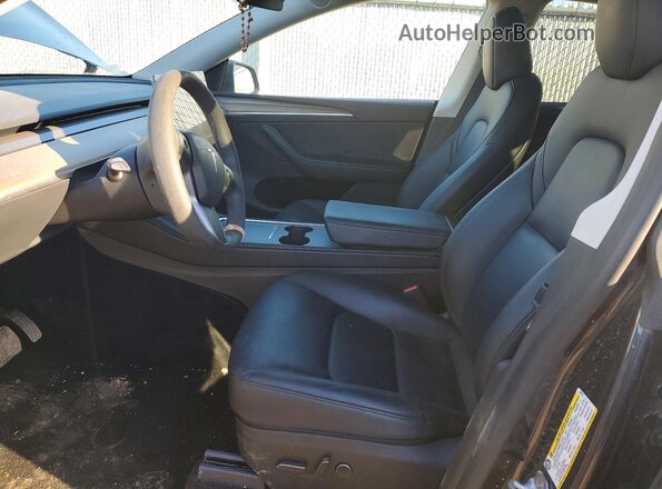 7SAYGDEE5RF989313 2024 TESLA MODEL Black Front interior view