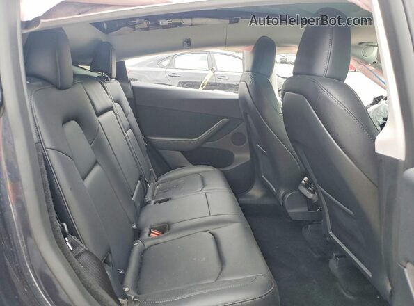 7SAYGDEE5SF256460 2025 TESLA MODEL Charcoal Rear seats view