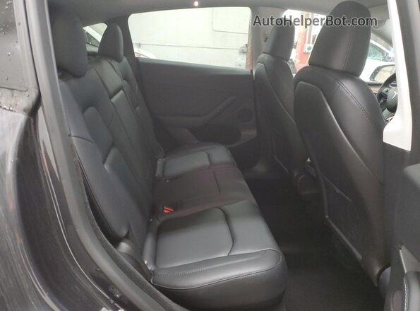 7SAYGDEE8RF176659 2024 TESLA MODEL Charcoal Rear seats view