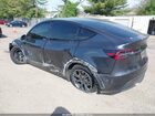 2024 Tesla Model Y Long Range Dual Motor All-wheel Drive Gray vin: 7SAYGDEE9RA329434