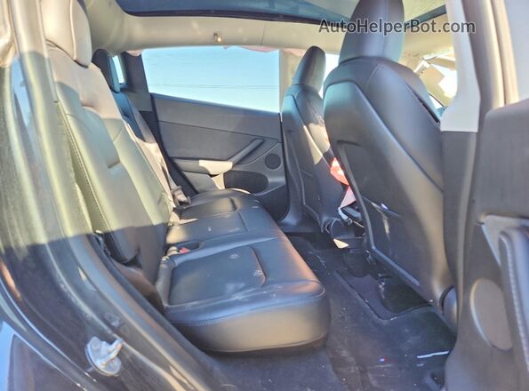 7SAYGDEE9RF994045 2024 TESLA MODEL Black Rear seats view