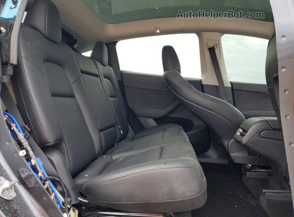 7SAYGDEF7RF085780 2024 TESLA MODEL Gray Vista de los asientos traseros