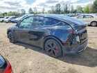 2026 Tesla Model Y Black vin: 7SAYGDET9TA629092