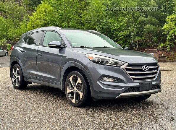 KM8J3CA2XGU194869 2016 HYUNDAI TUCSON Gray Vista tres cuartos delantera izquierda