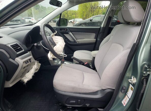JF2SJAEC0JH489910 2018 SUBARU FORESTER Зеленый Вид салона спереди