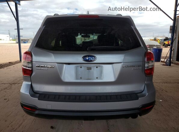 JF2SJAXC3GH490555 2016 SUBARU FORESTER Silver Widok z tyłu