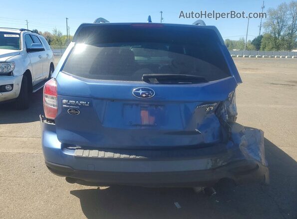 JF2SJGDC9GH524439 2016 SUBARU FORESTER Blue Vista trasera