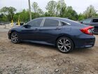 2019 Honda Civic Touring Угольный vin: JHMFC1F95KX003028