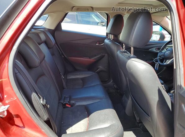 JM1DKFD75G0140450 2016 MAZDA CX-3 Red Vista de los asientos traseros