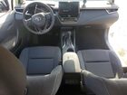 2025 Toyota Corolla Hybrid Le Silver vin: JTDBCMFE4S3099062