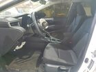 2026 Toyota Corolla Hybrid Le White vin: JTDBCMFE5T3116579